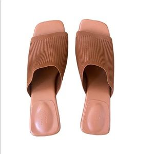 Size 10. 1 inch heel. Stretchy cross fabric. Worn twice.